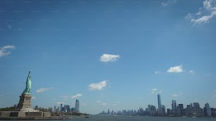 a view of the statue of liberty from across the water