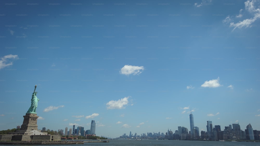 a view of the statue of liberty from across the water