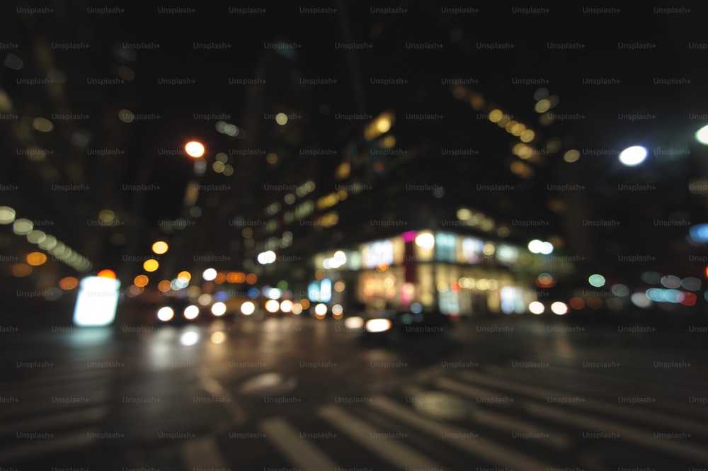 a blurry photo of a city street at night