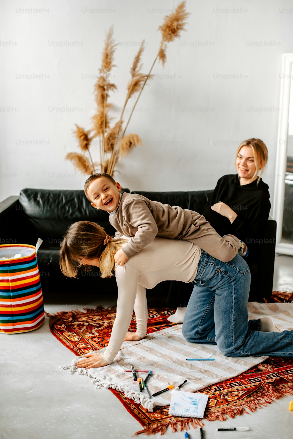 a couple of people standing on top of a rug