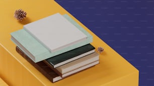 a stack of books sitting on top of a yellow table