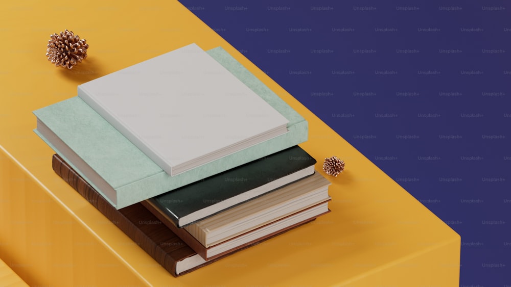uma pilha de livros sentados em cima de uma mesa amarela