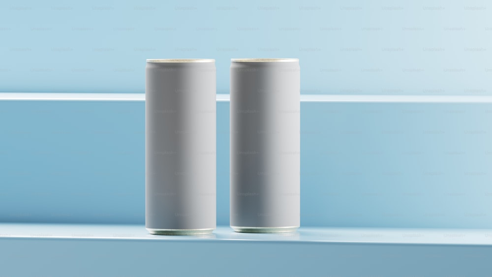 a couple of white cans sitting on top of a shelf