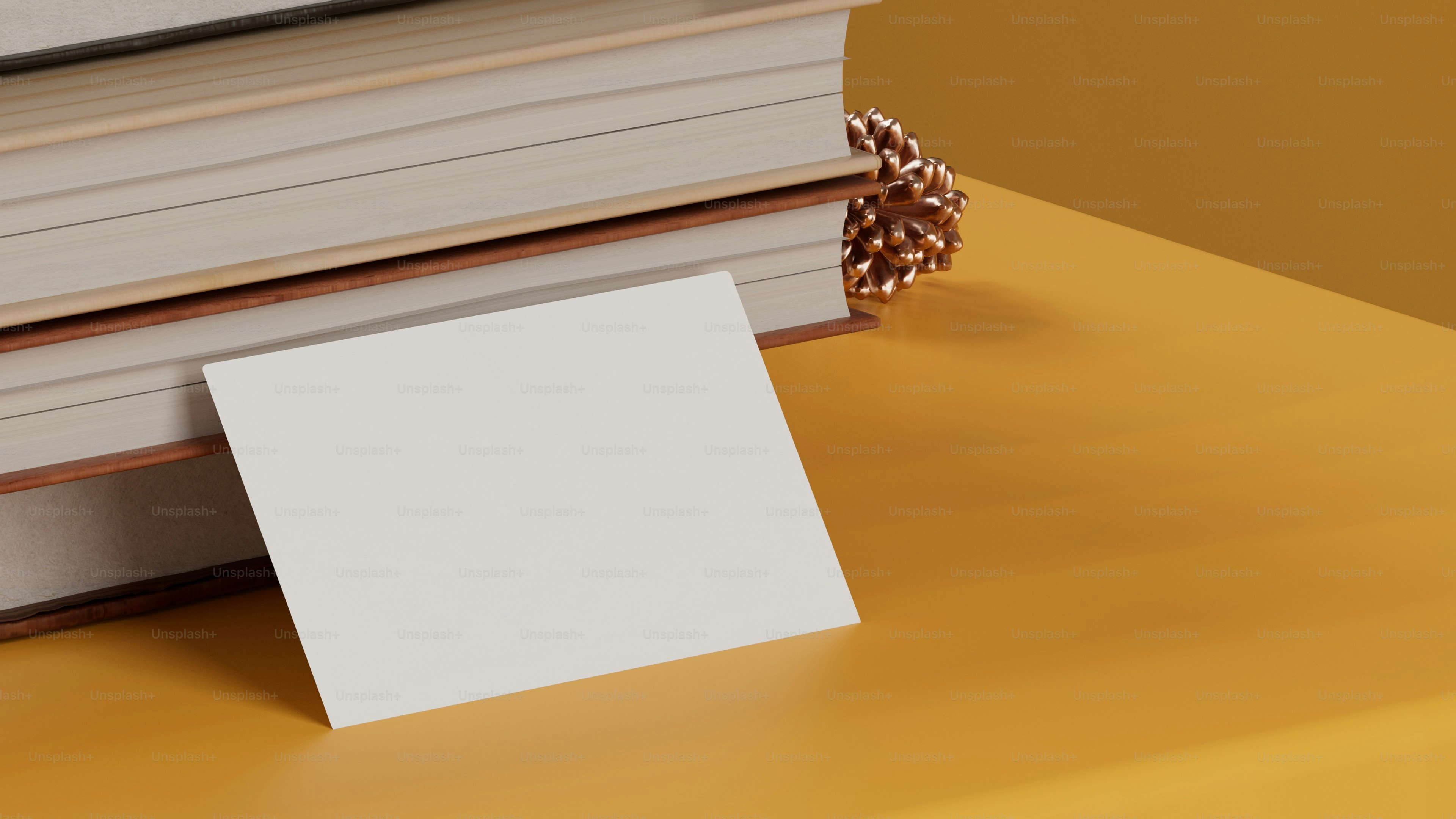 a stack of books sitting on top of a yellow table