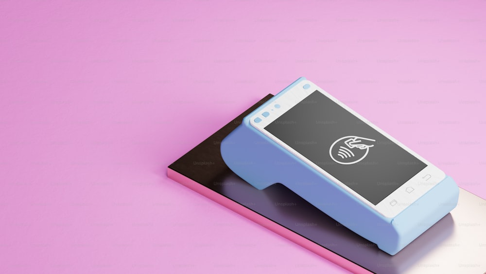 a cell phone sitting on top of a pink surface