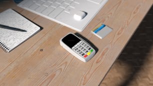 un téléphone portable posé sur un bureau en bois