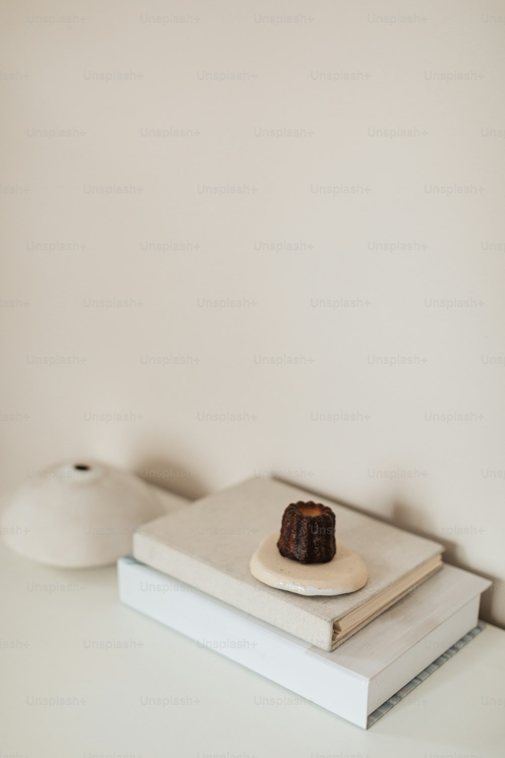 a small piece of cake sitting on top of a book