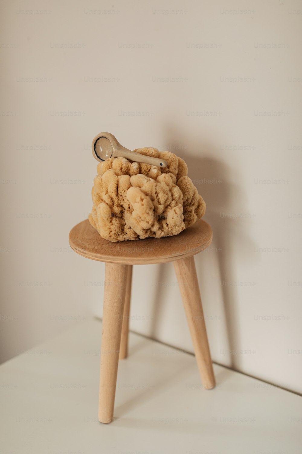 a wooden stool with a hair dryer on top of it