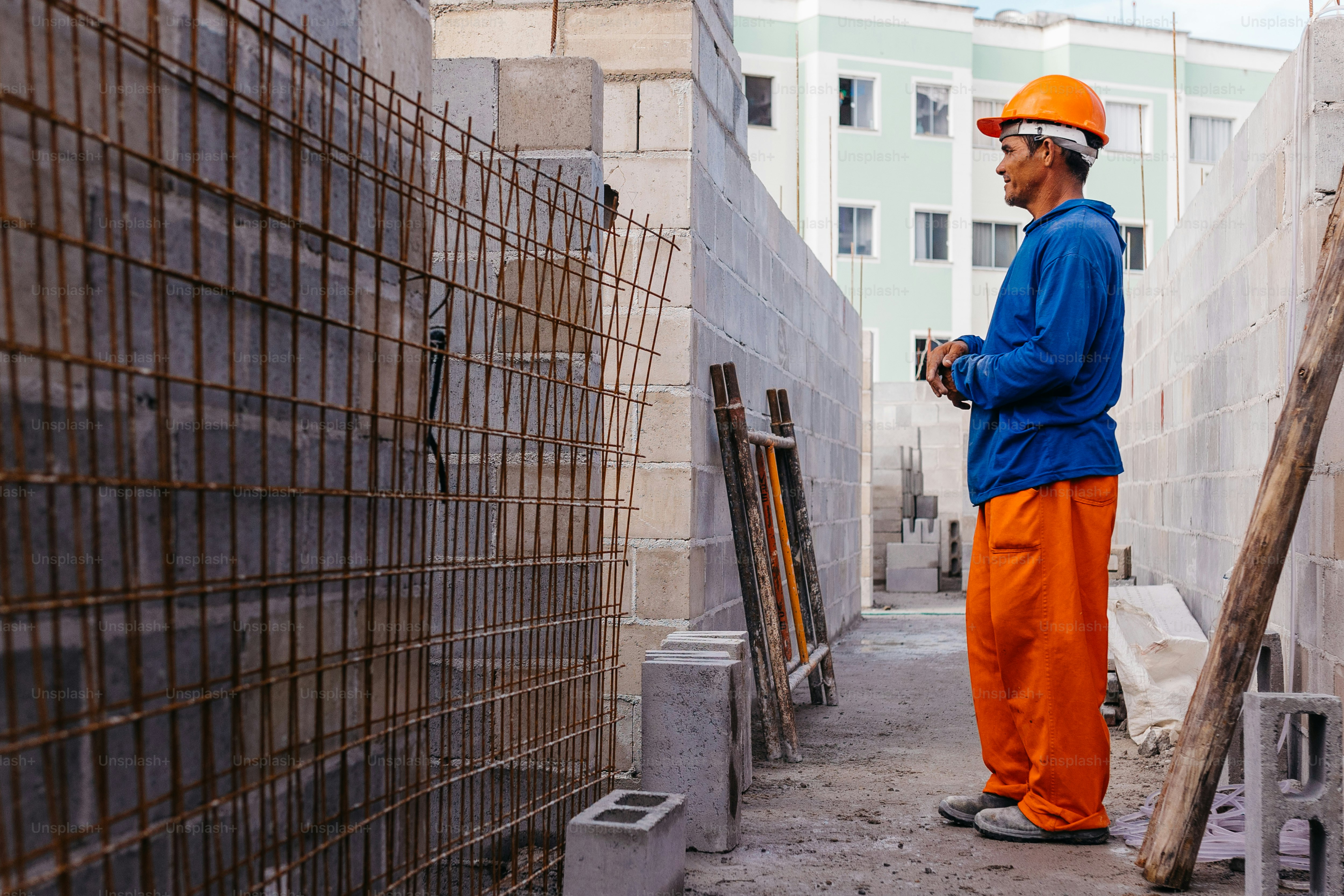 a man in orange pants and a blue jacket