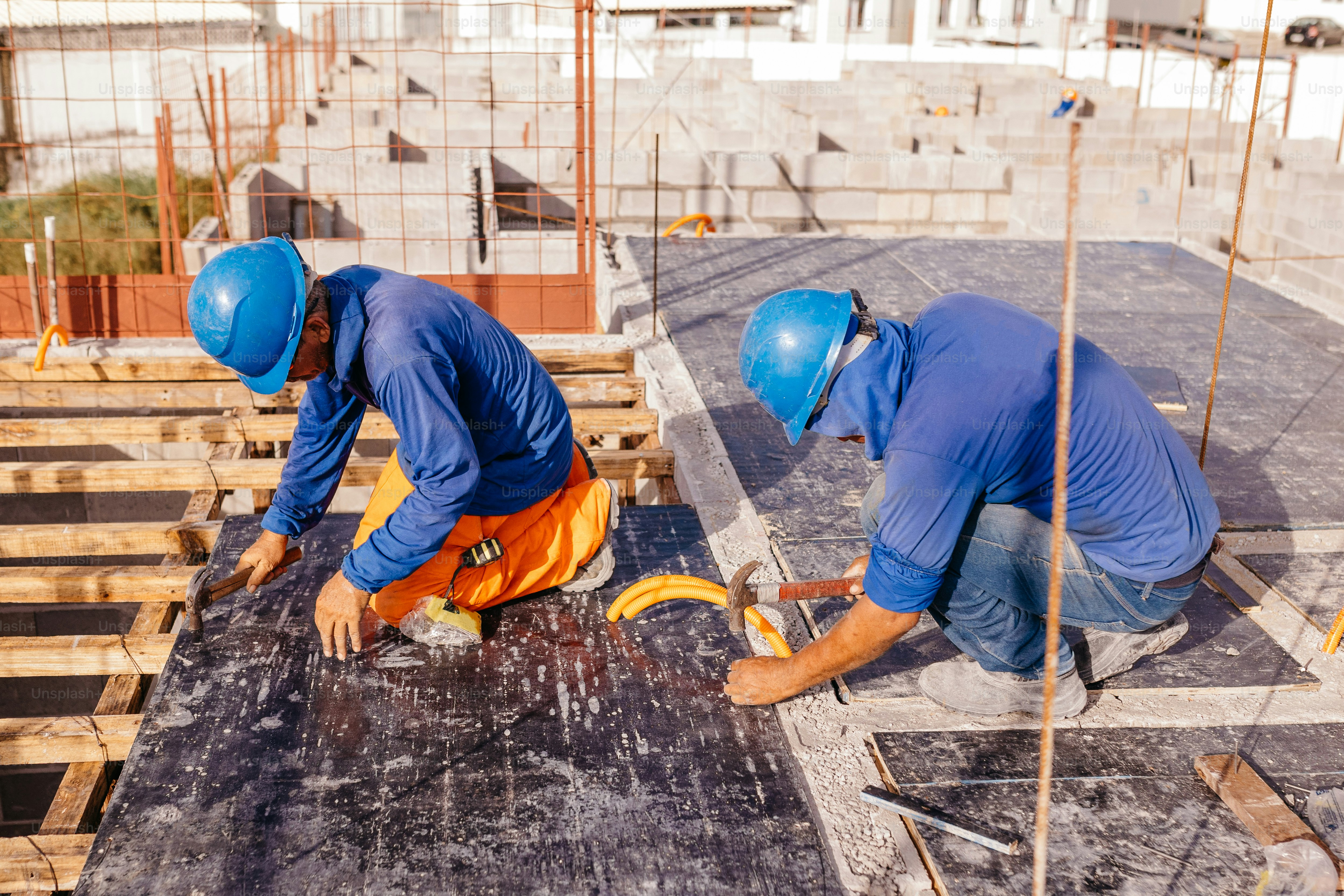 Two men working on a roof