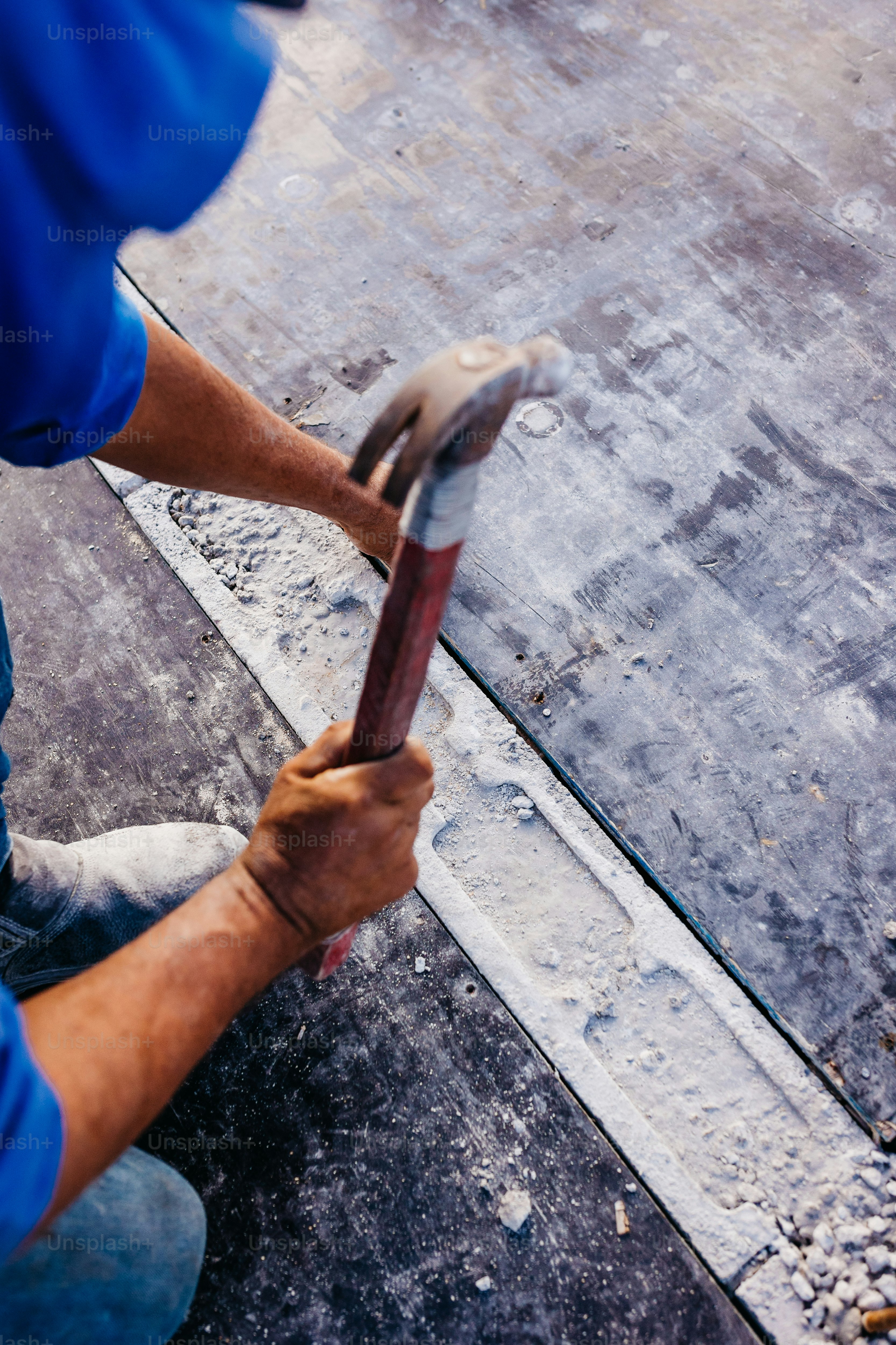 a man holding a hammer in his right hand
