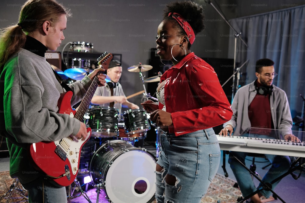 a group of people playing instruments in a room