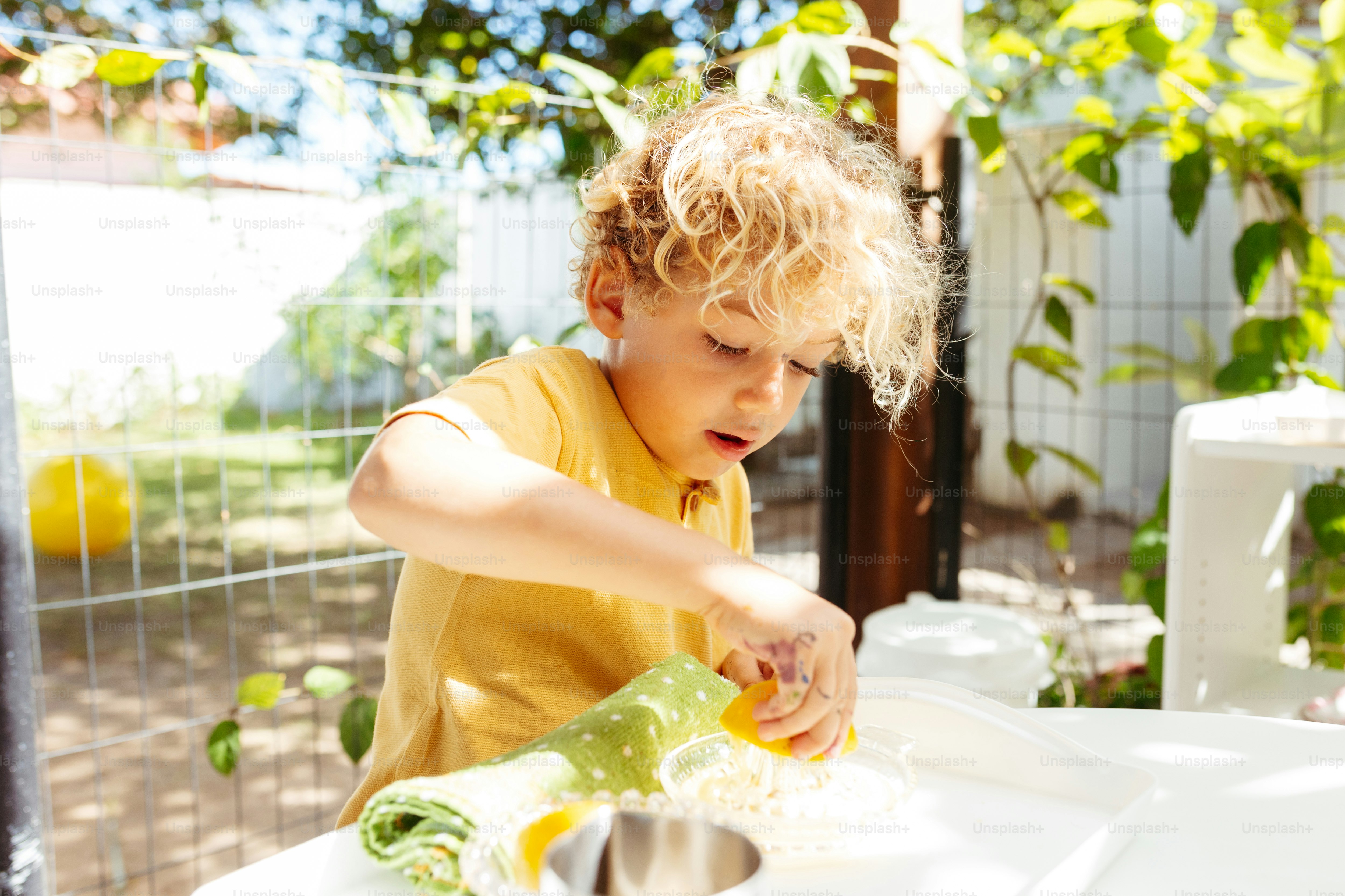 a little boy that is sitting at a table