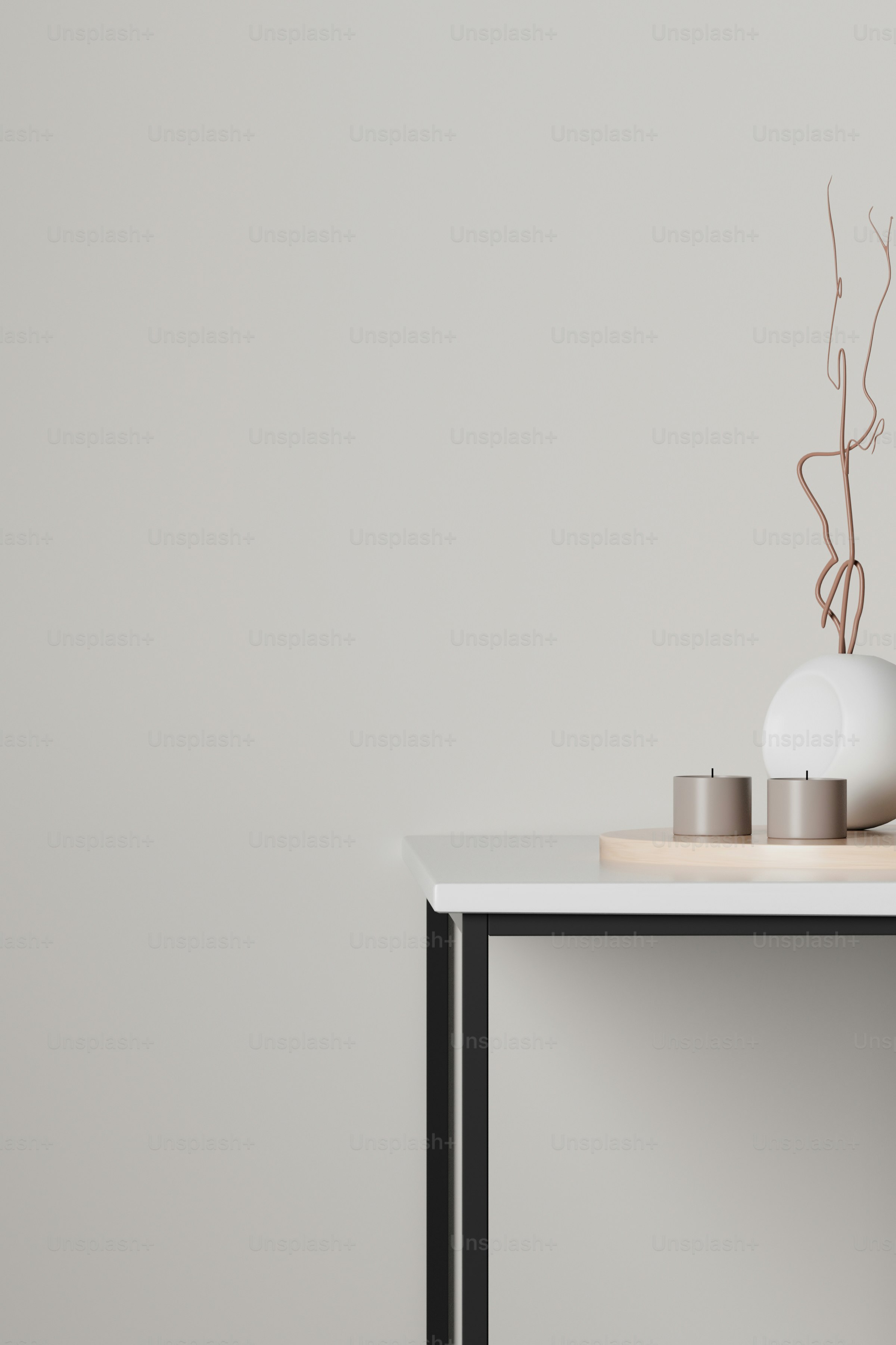 a table with a vase and candles on it