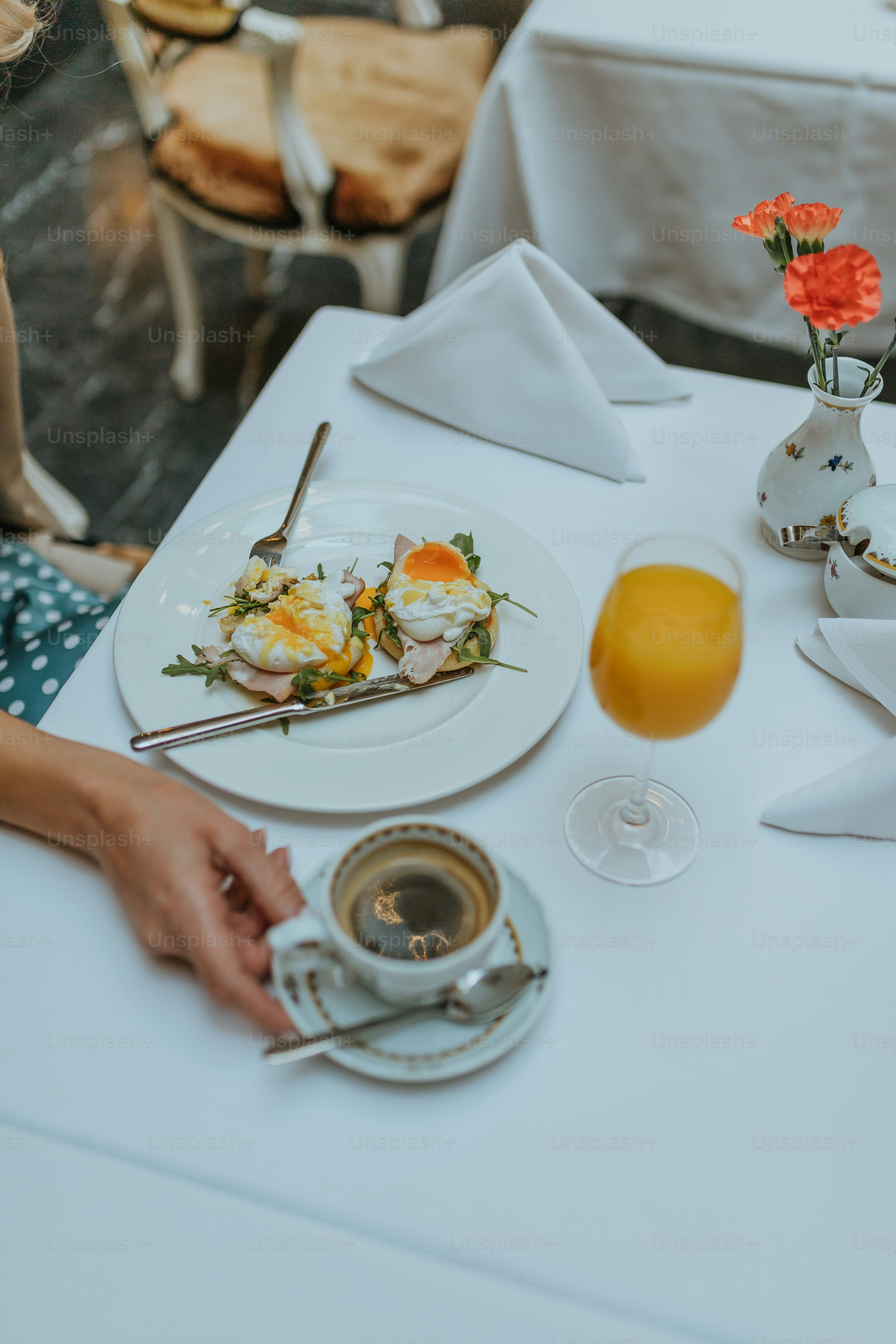 a table with a plate of food and a cup of tea
