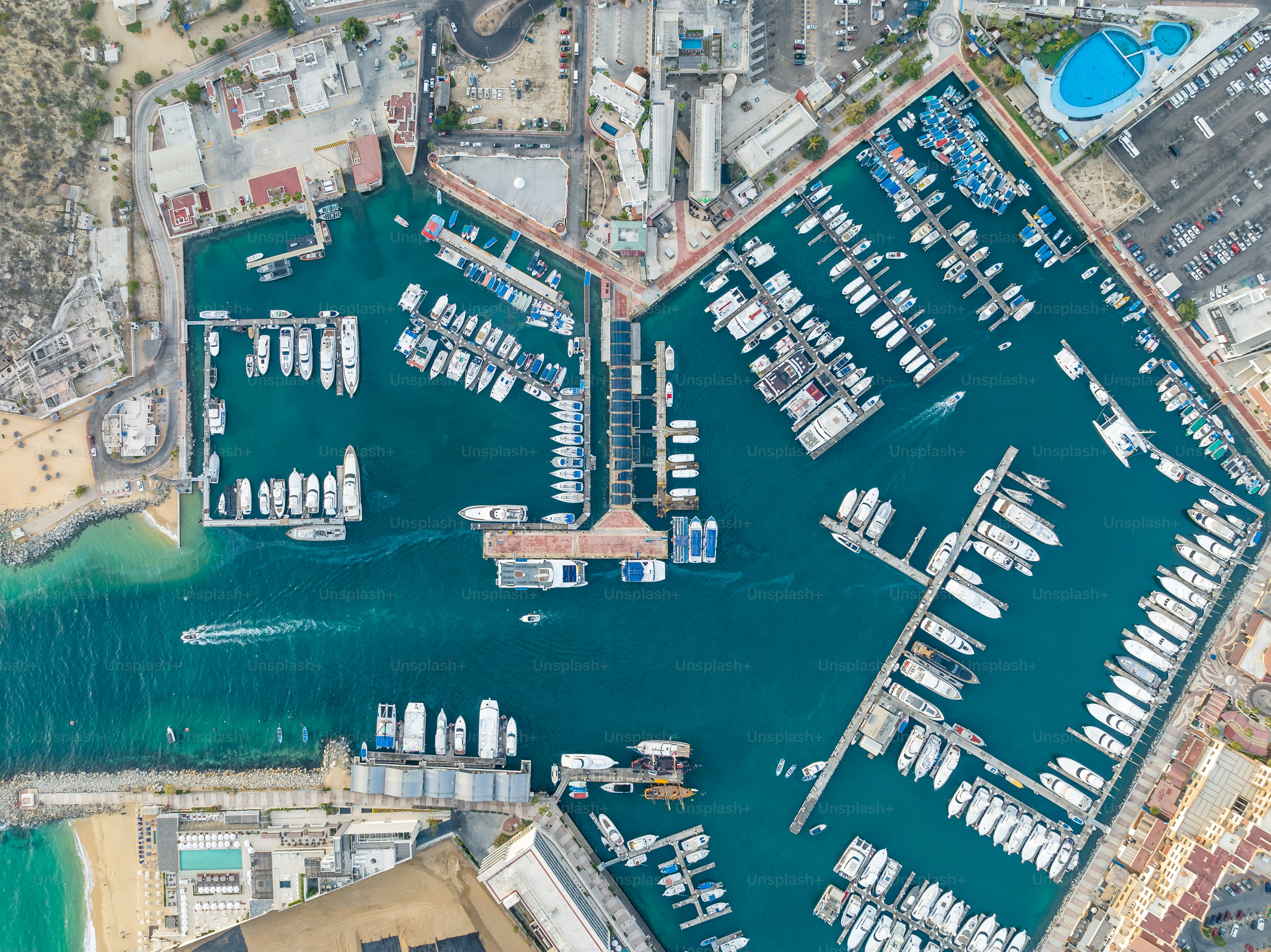 an aerial view of a marina with many boats