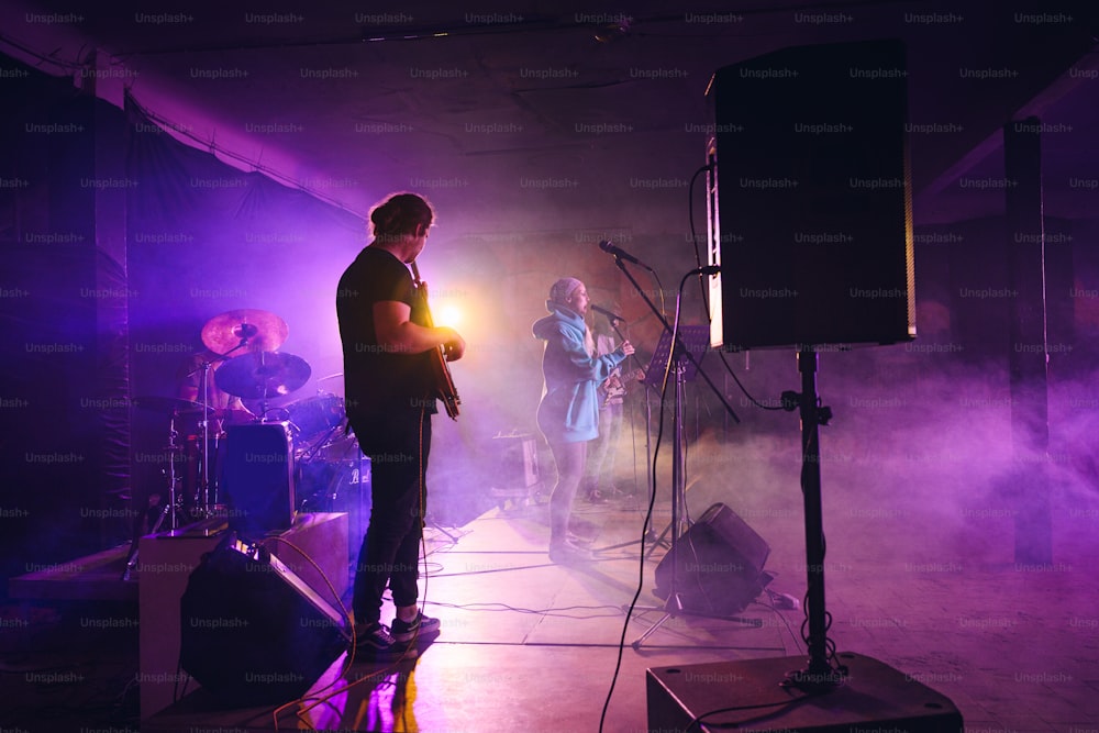 a group of people standing on top of a stage