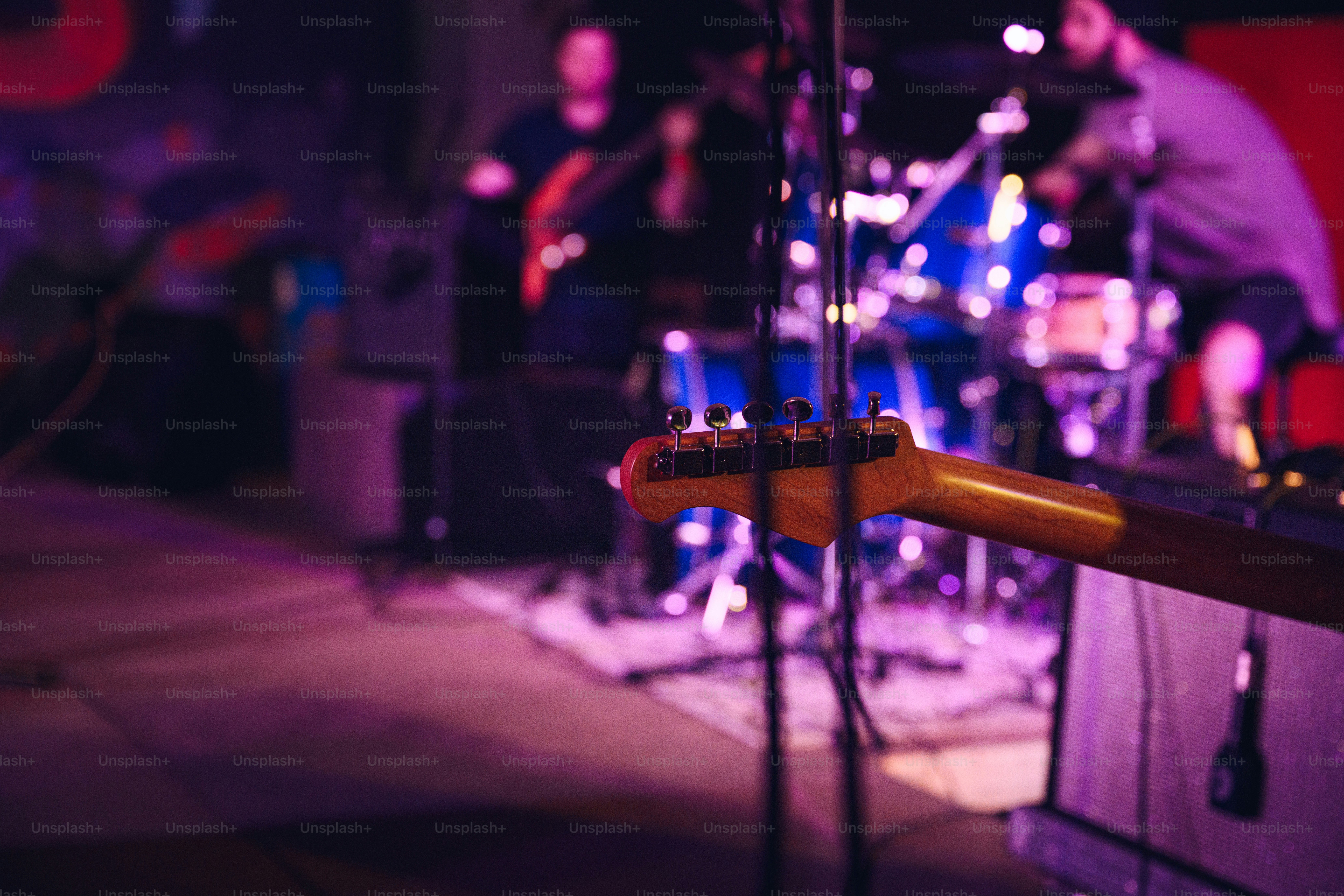 a group of people playing instruments on a stage