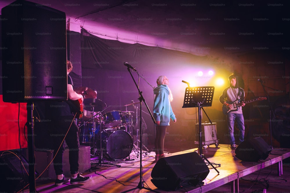 a group of people that are standing on a stage