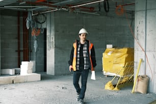 a man wearing a hard hat and safety vest