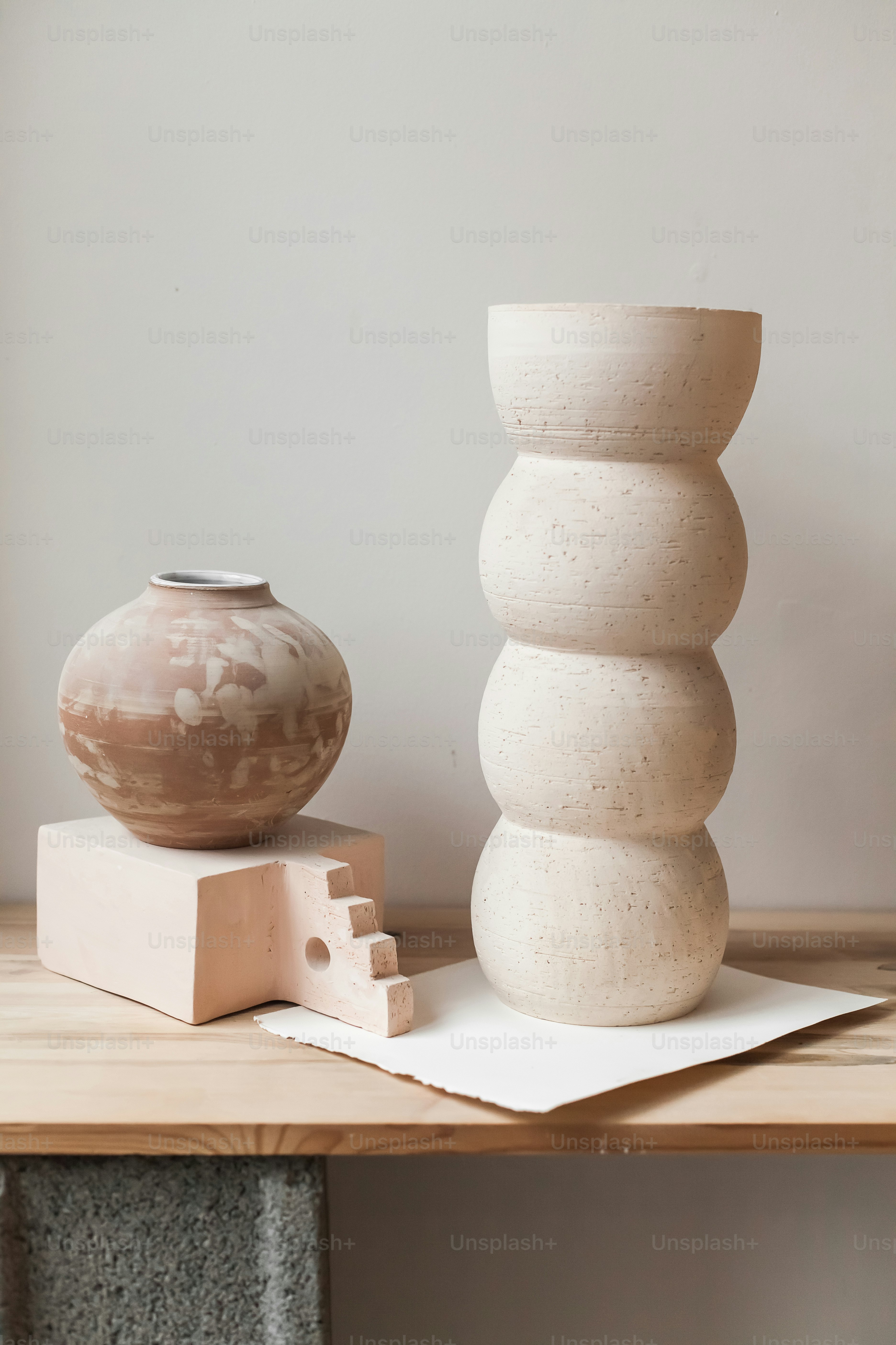 A white vase sitting on top of a wooden table photo – Minimalist Image ...