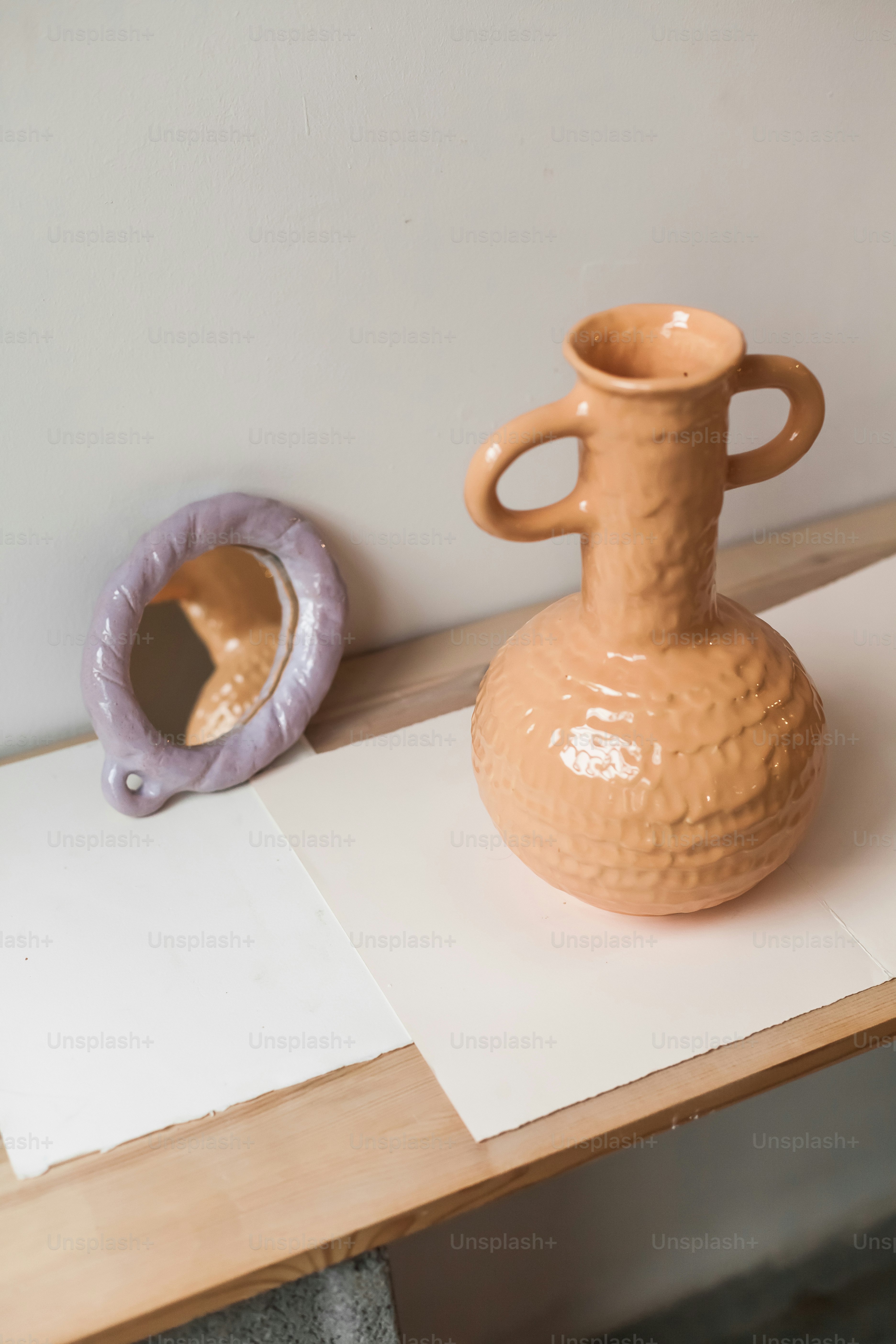 A brown vase sitting on top of a wooden table photo – Aesthetic Image ...