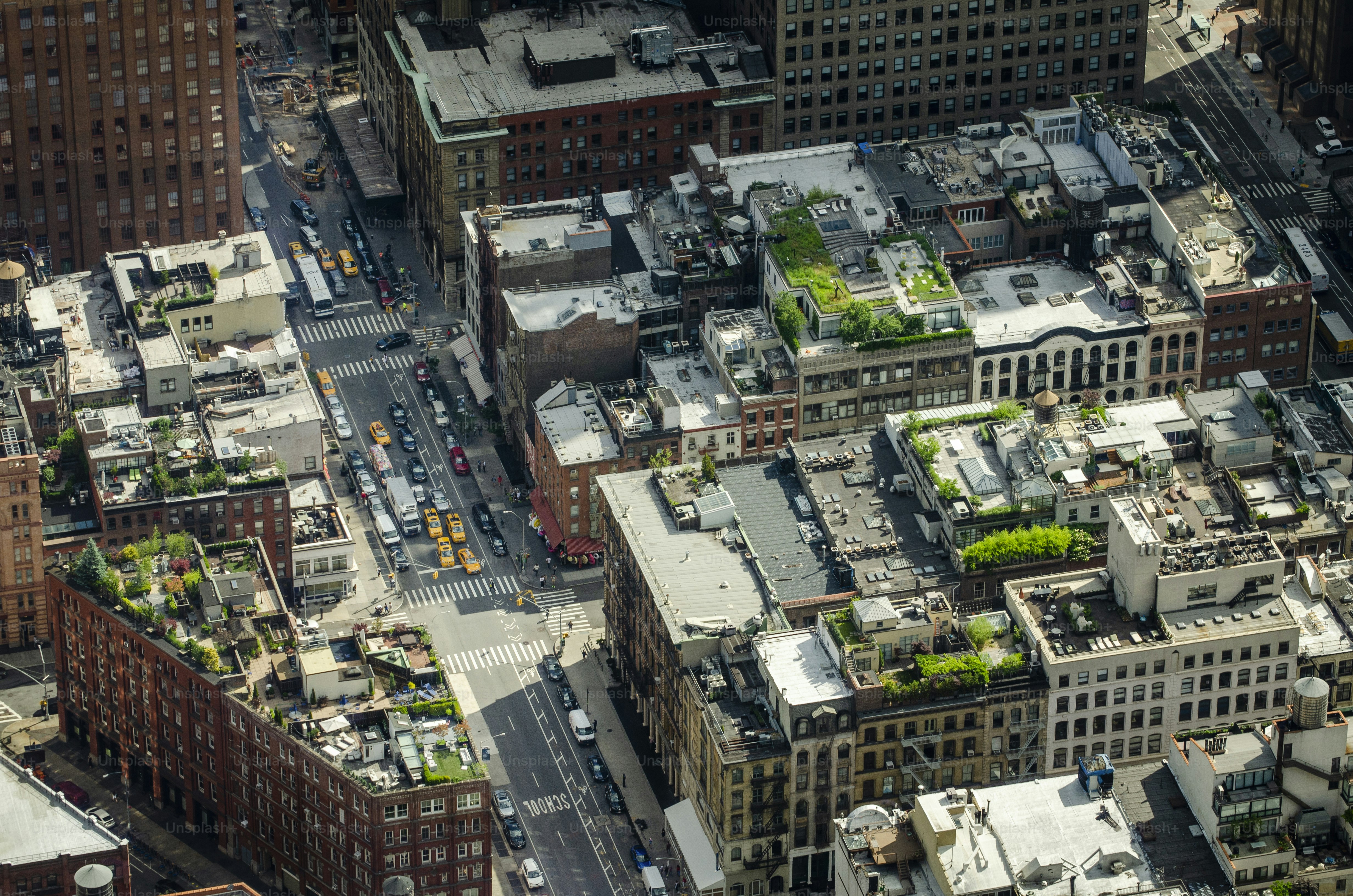 an aerial view of a city with lots of tall buildings