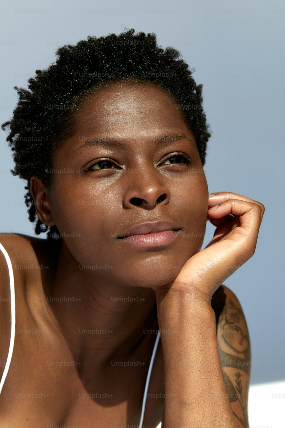 a close up of a person wearing a tank top