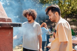 a couple of men standing next to each other