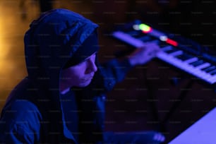 a person sitting in front of a keyboard