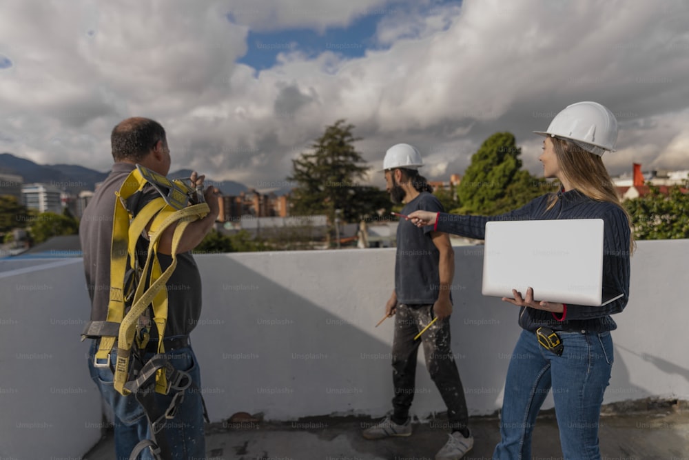 a group of people standing on top of a roof