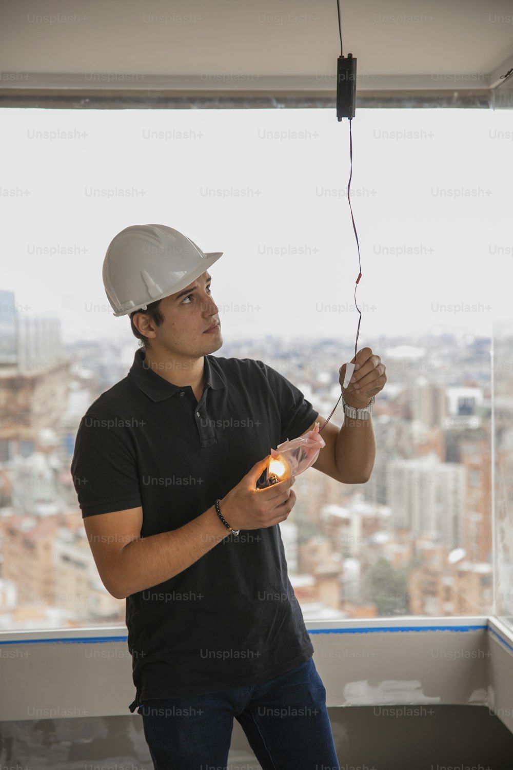 a man in a hard hat is holding a light