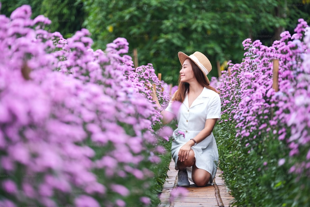 Portrait image of a beautiful young asian woman in Margaret flower field