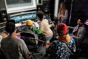 a group of people in a recording studio