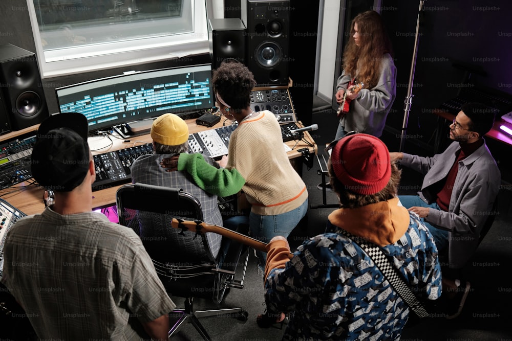 a group of people in a recording studio