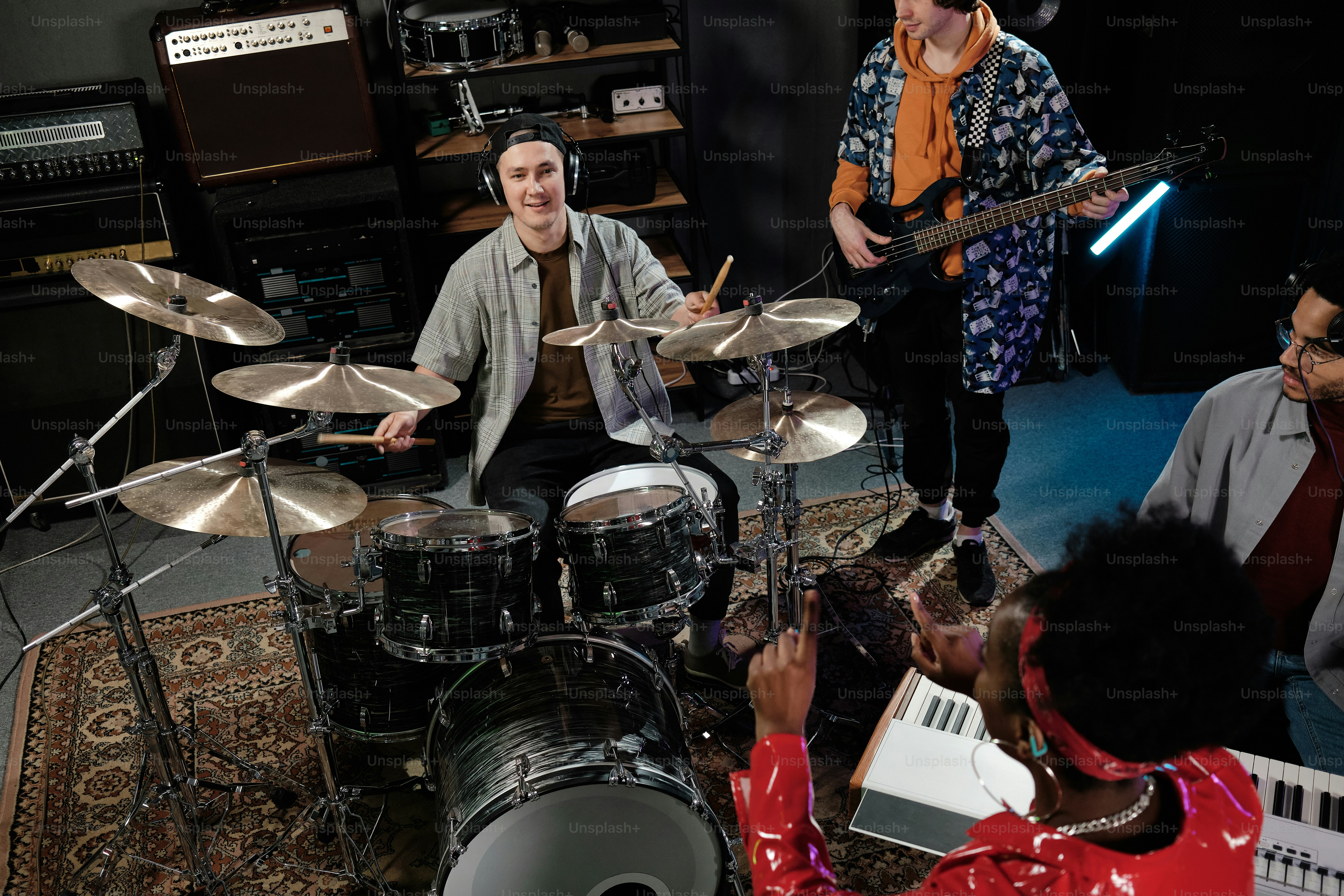 a group of people in a room with musical instruments