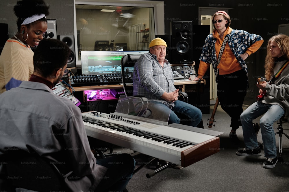 a group of people in a recording studio