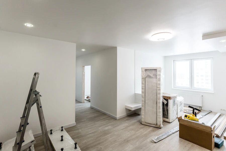 Home renovation interior with painting tools ready for post-construction cleaning