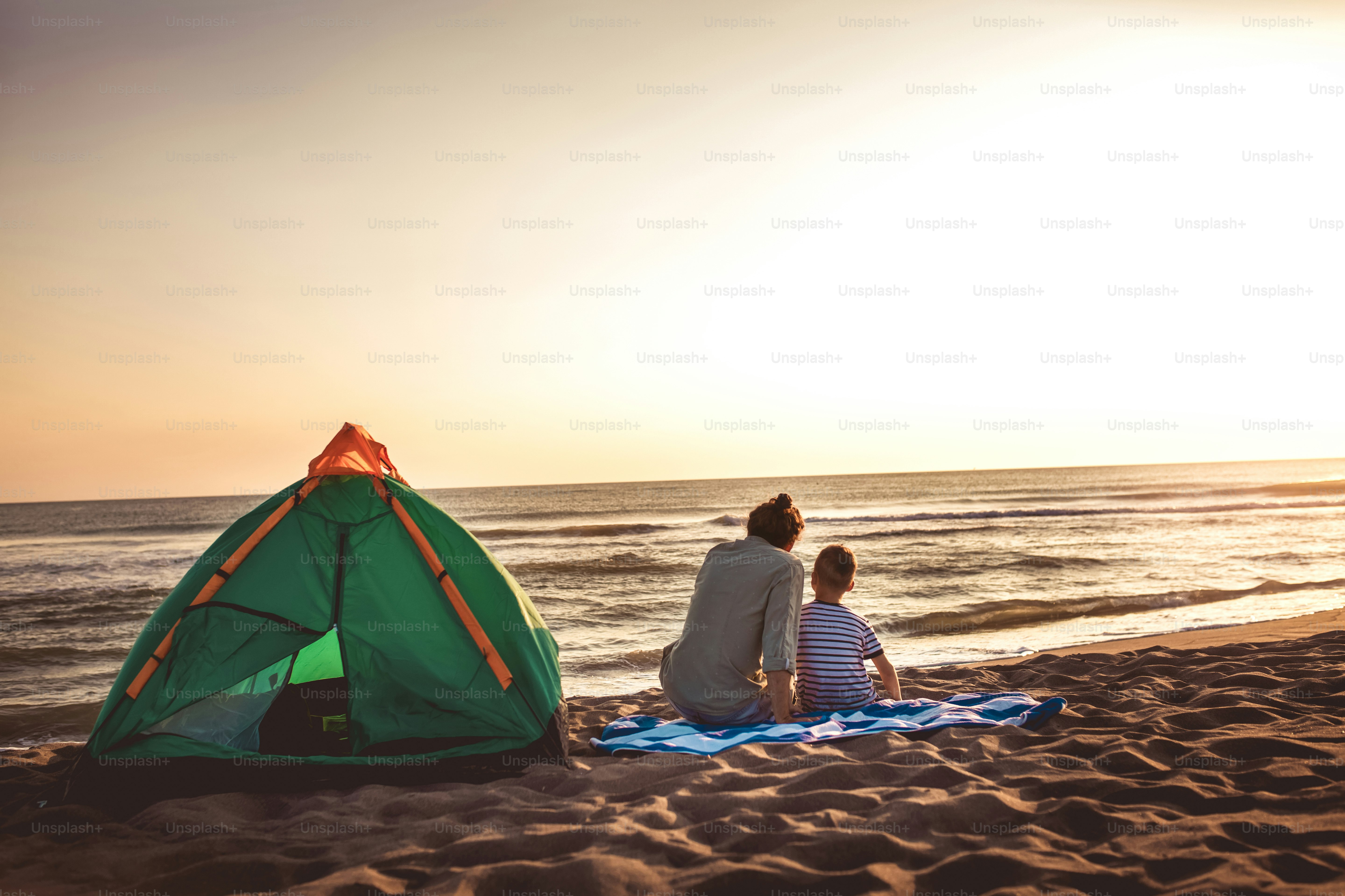 Father and son at the beach having fun