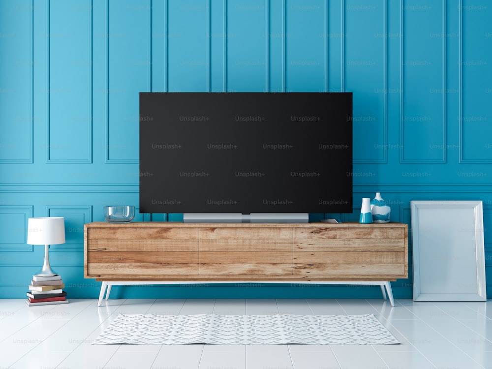 Smart Tv Mockup standing on console in modern interior with blue wall. 3d rendering