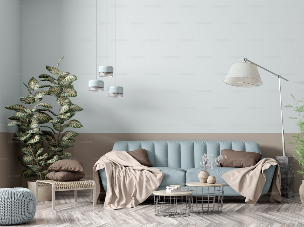 Intérieur moderne de l’appartement, salon avec canapé bleu, lampadaire, tables basses et rendu 3D végétal
