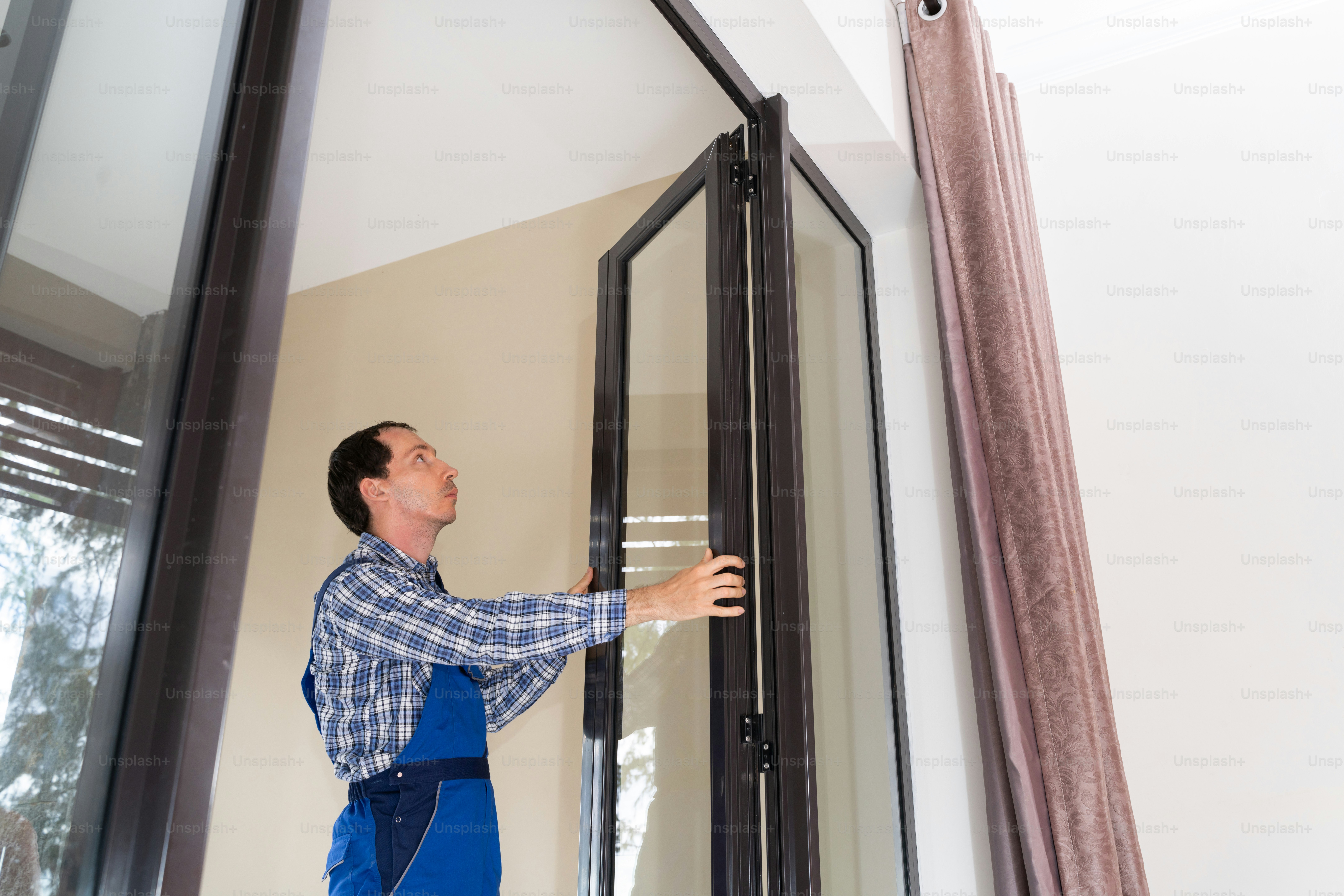 Close-up Of A Repairman's Hand Fixing Window