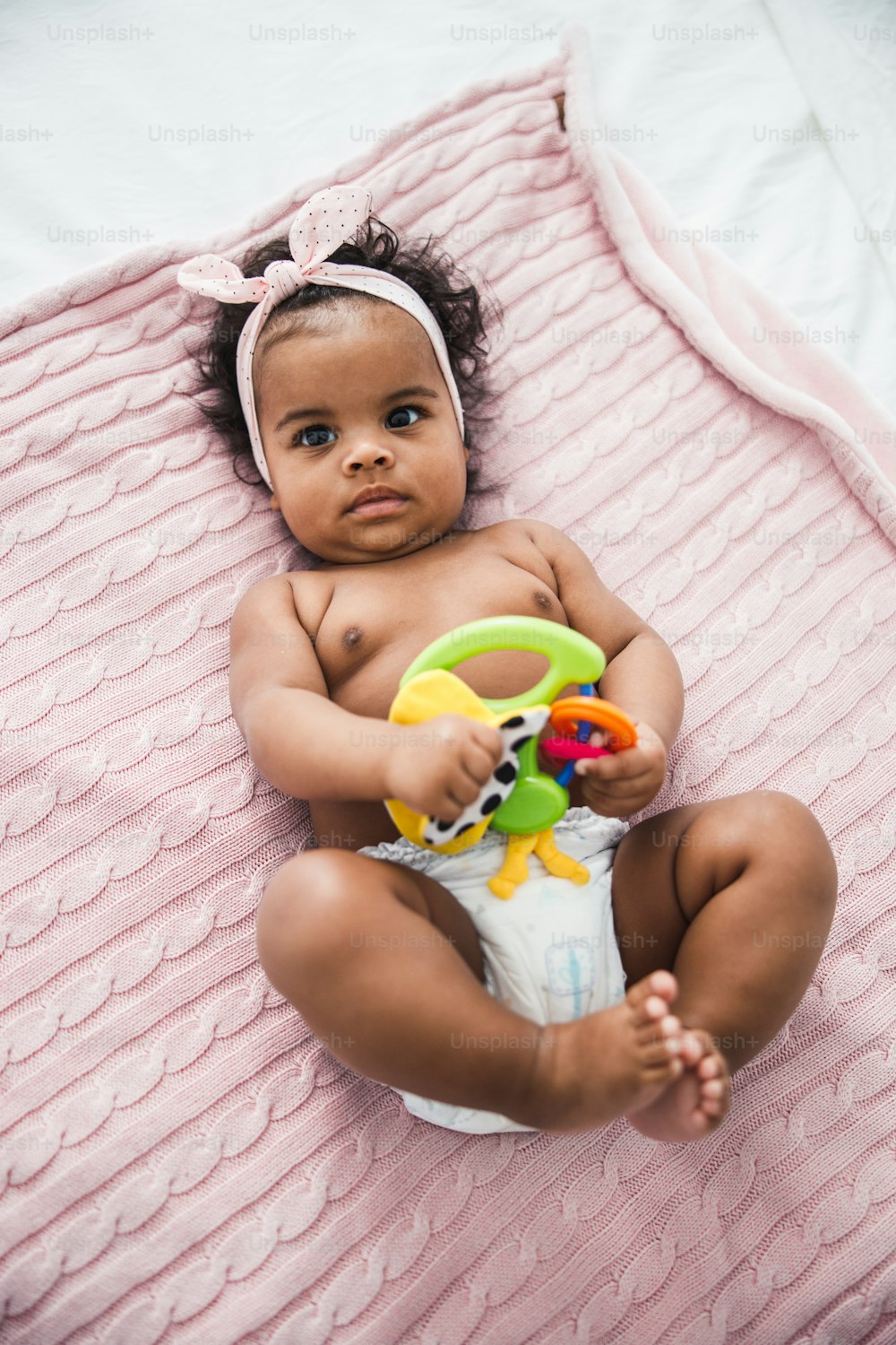 Adorable Afro American child holding toy stock photo