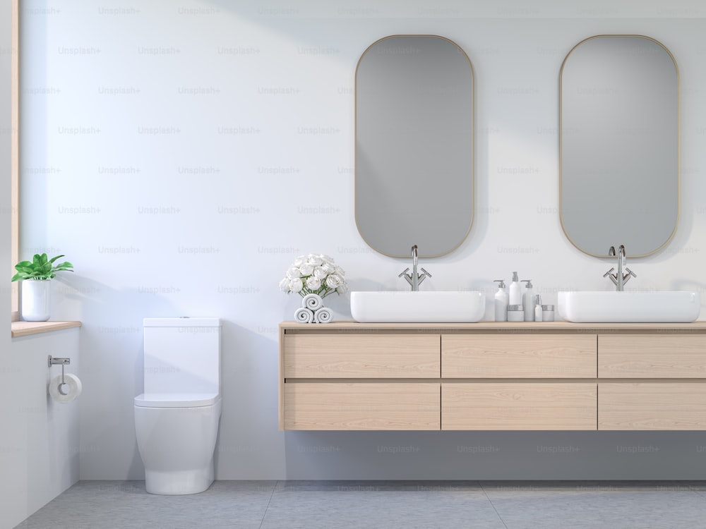 Style minimal de style contemporain salle de bains 3D rendu, La chambre a des murs blancs et des sols en carreaux de béton décorés avec des armoires en bois et des cadres en verre doré. La lumière du soleil pénètre dans la pièce.