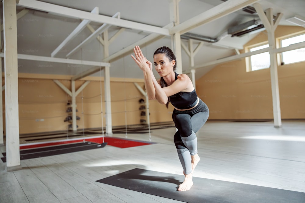 Premium Photo  Athletic woman balancing in yoga pose indoors