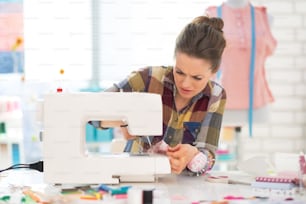 Seamstress sewing in studio