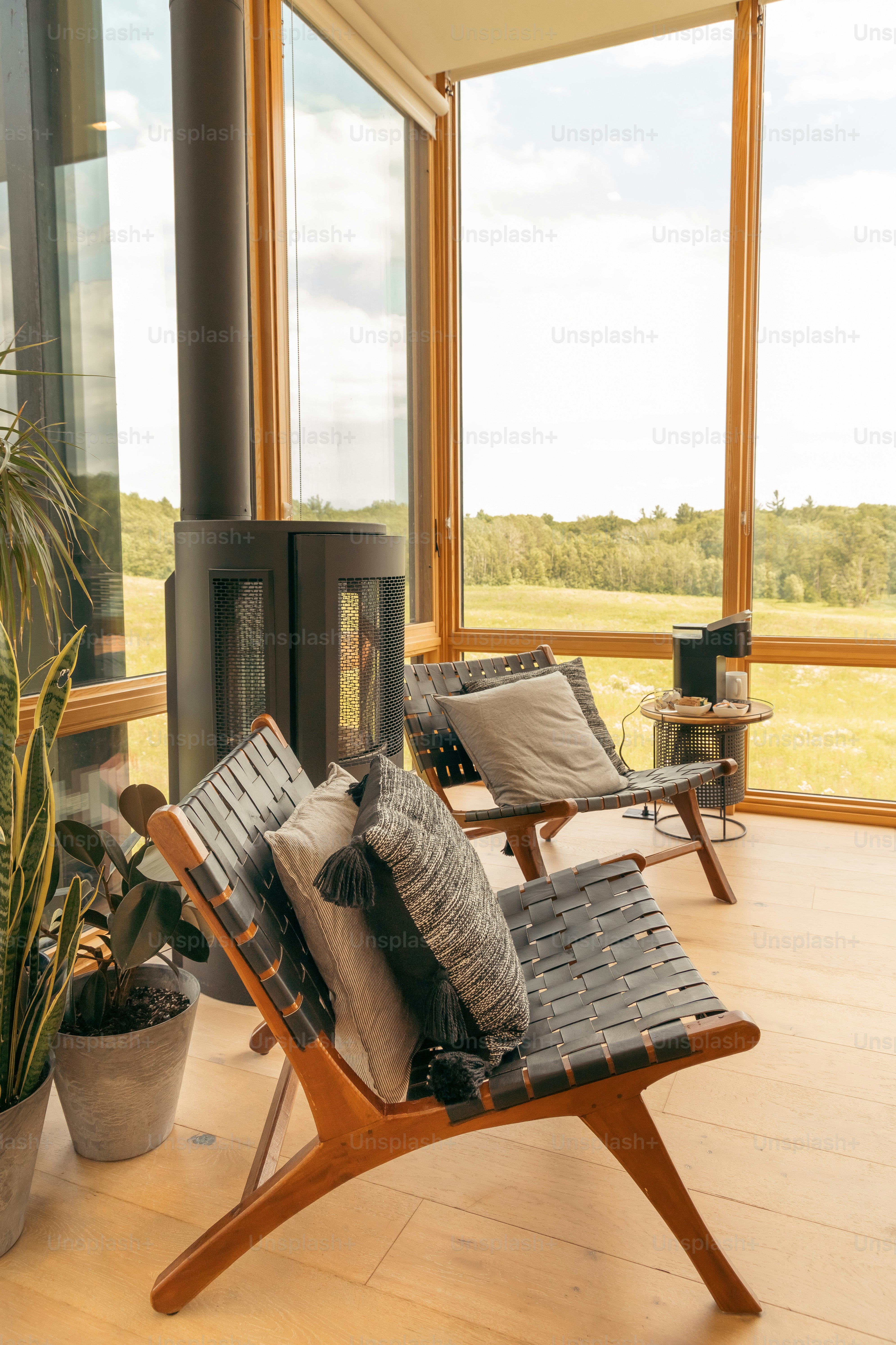 a living room with a lot of windows and furniture