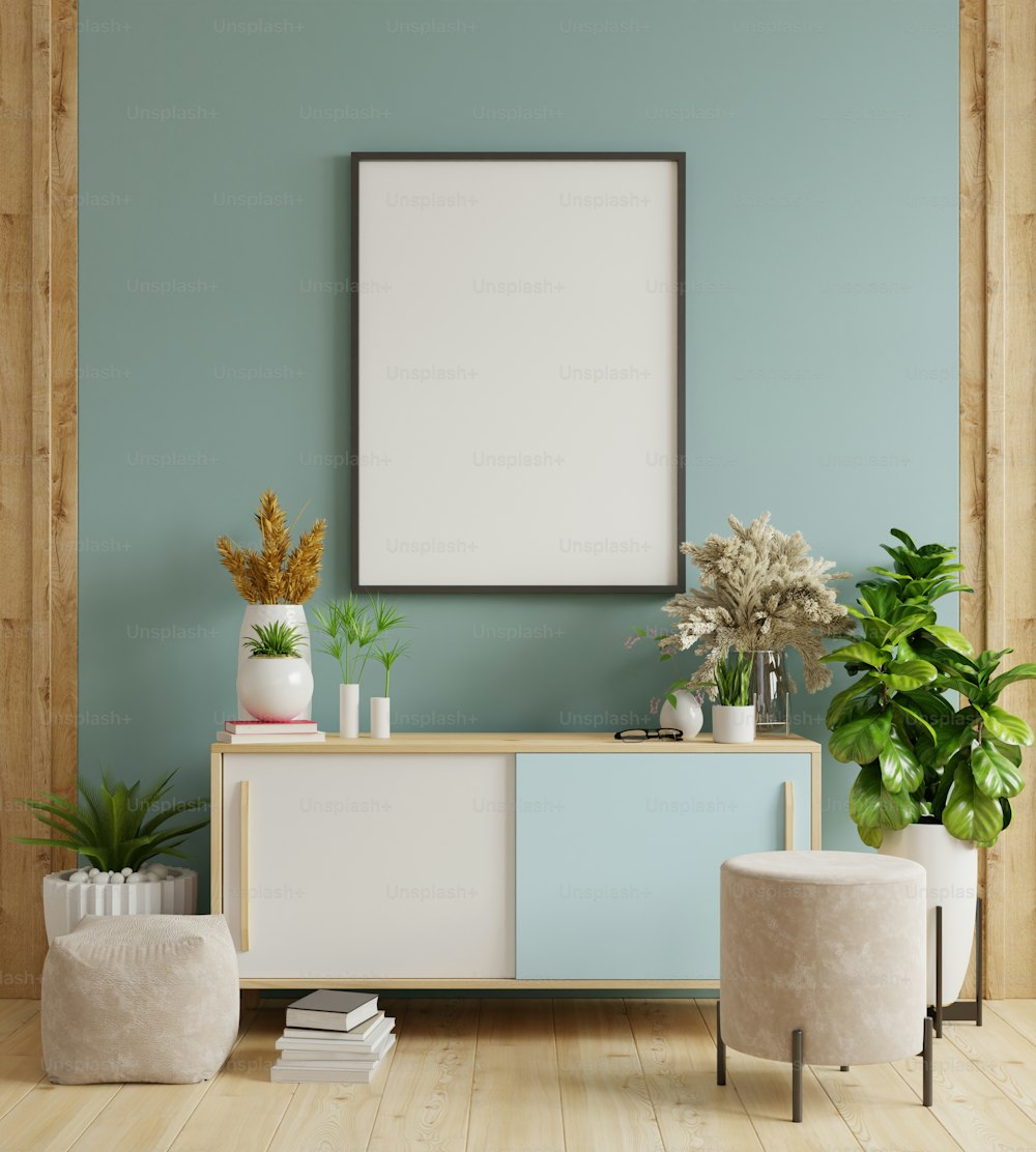 Mock up poster frame on cabinet in interior,Dark blue wall.3d rendering