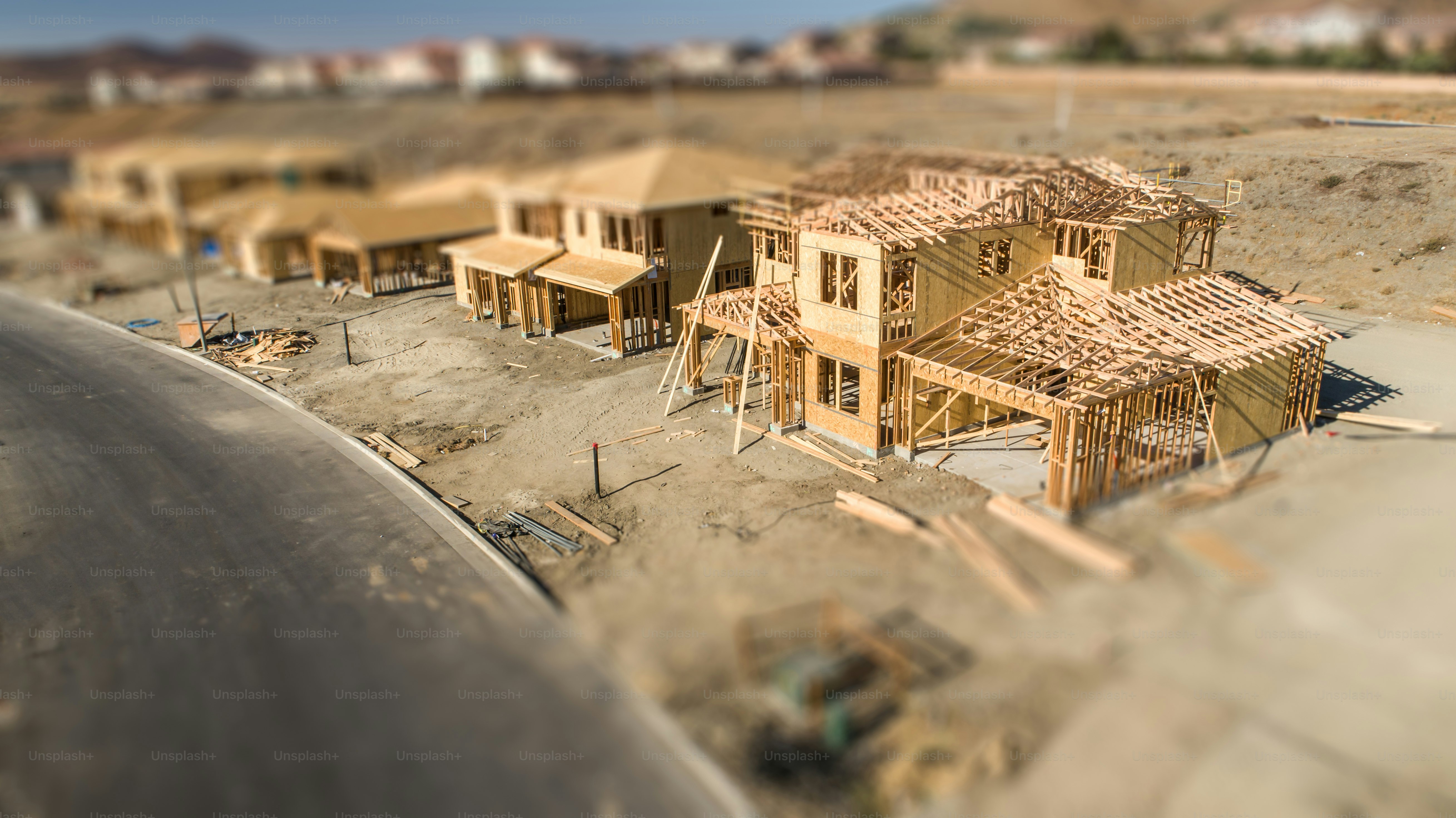 Aerial View of New Homes Construction Site with Tilt-Shift Blur.