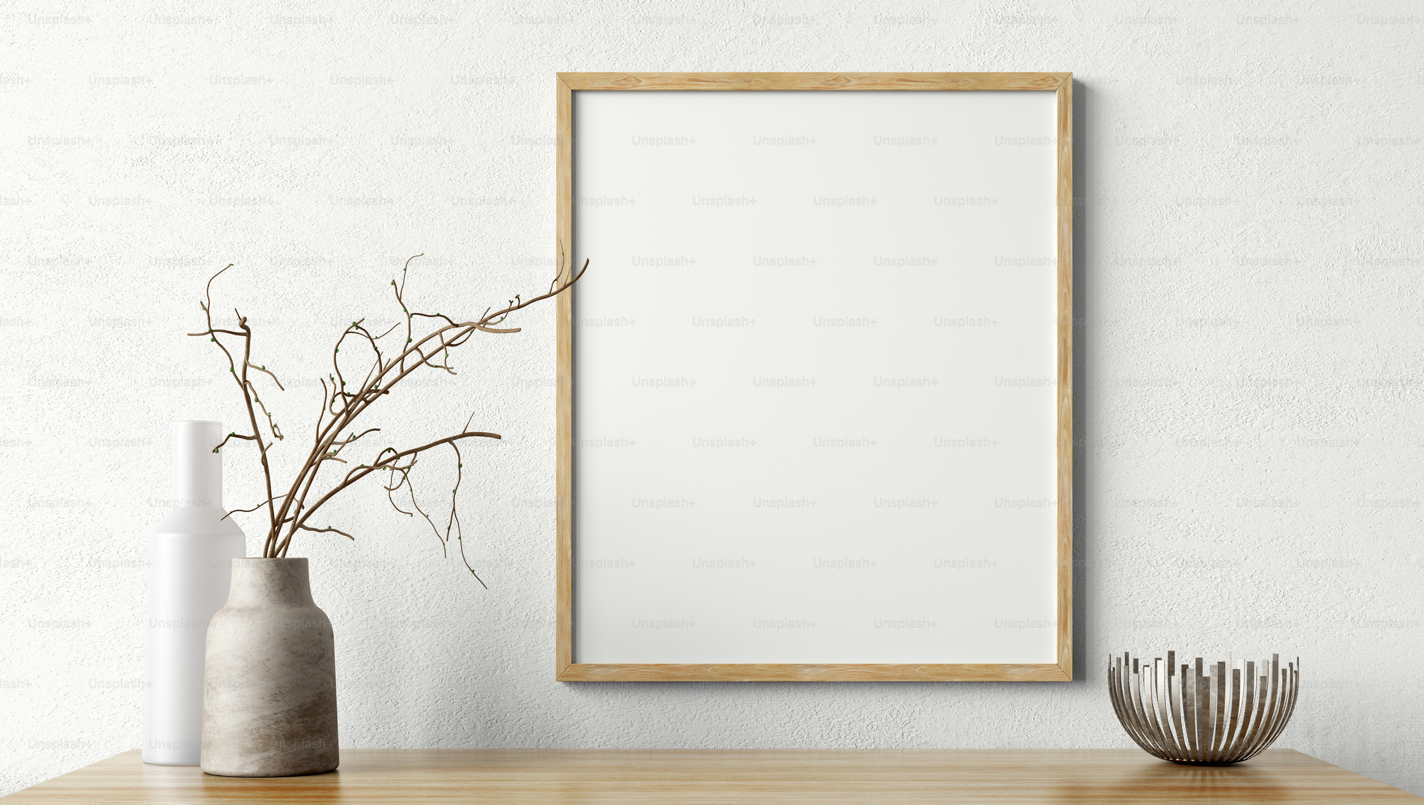 Living room decoration. Wooden mock up poster frame on white wall above the shelf. Home decor with vases. Interior background 3d rendering